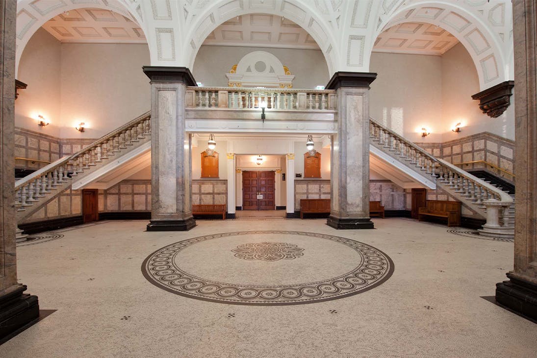 interior of brisbanes town hall with a grand staircase